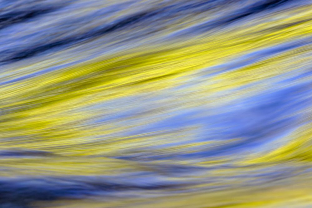 Spring foliage colors and sky reflecting on ripples on stream, Great Smoky Mountains NP, Tennessee